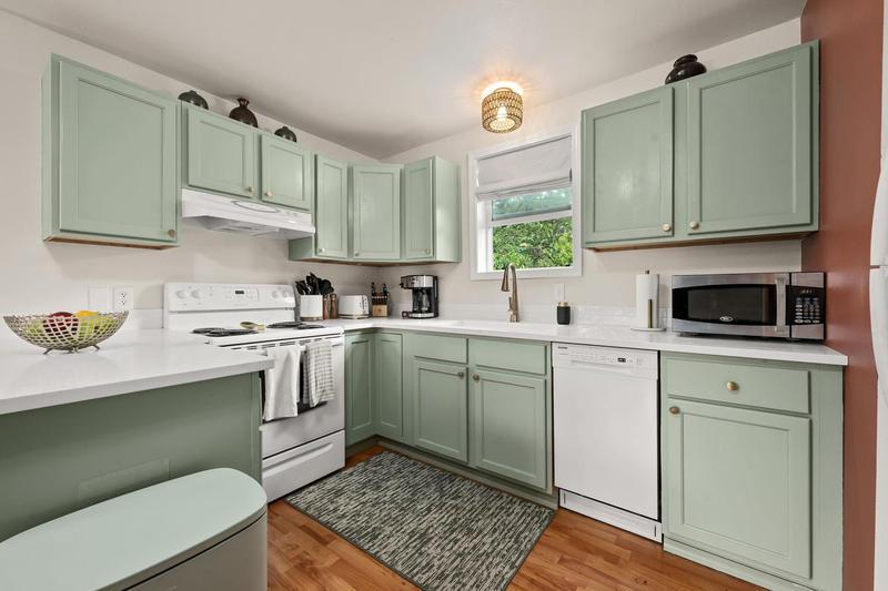 Kitchen with sage green cabinets