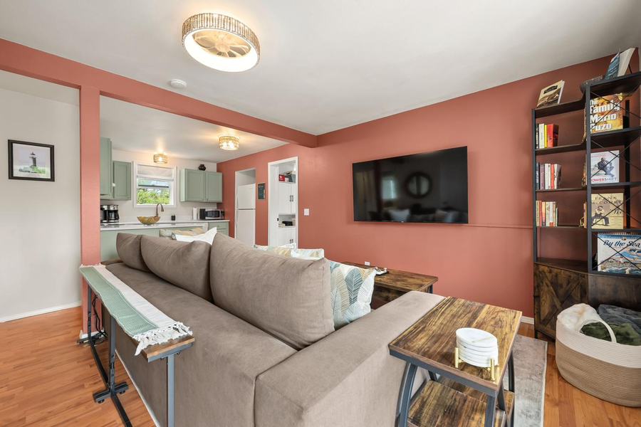 Living room with sectional, TV and bookshelf