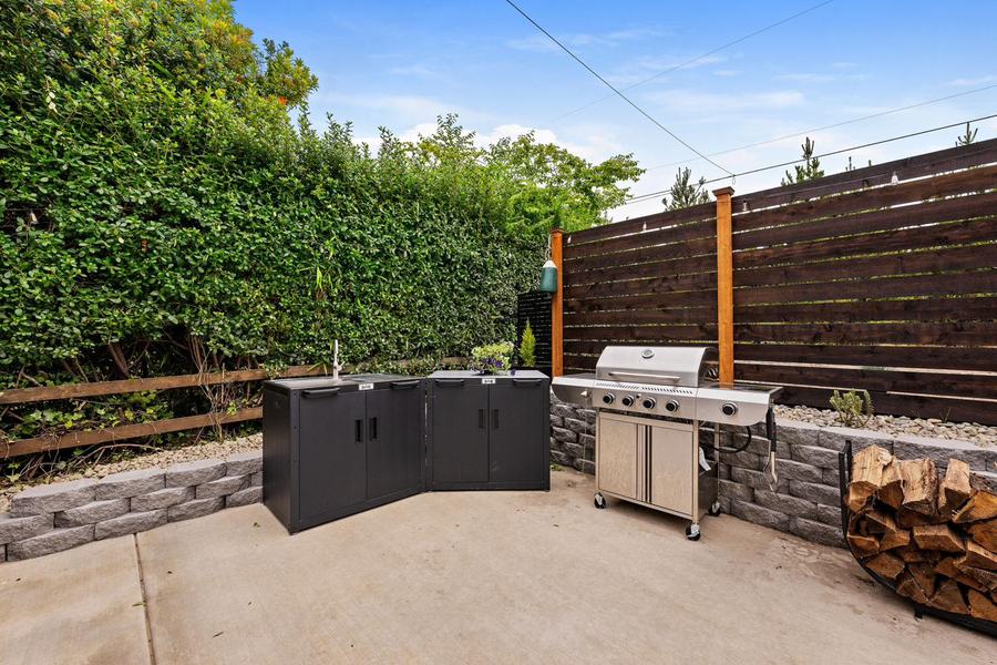 Outdoor kitchen with grill, sink and prep station